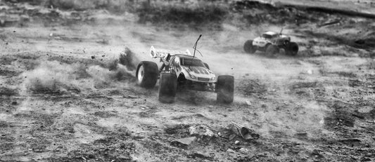 RC cars racing in the dirt ground
